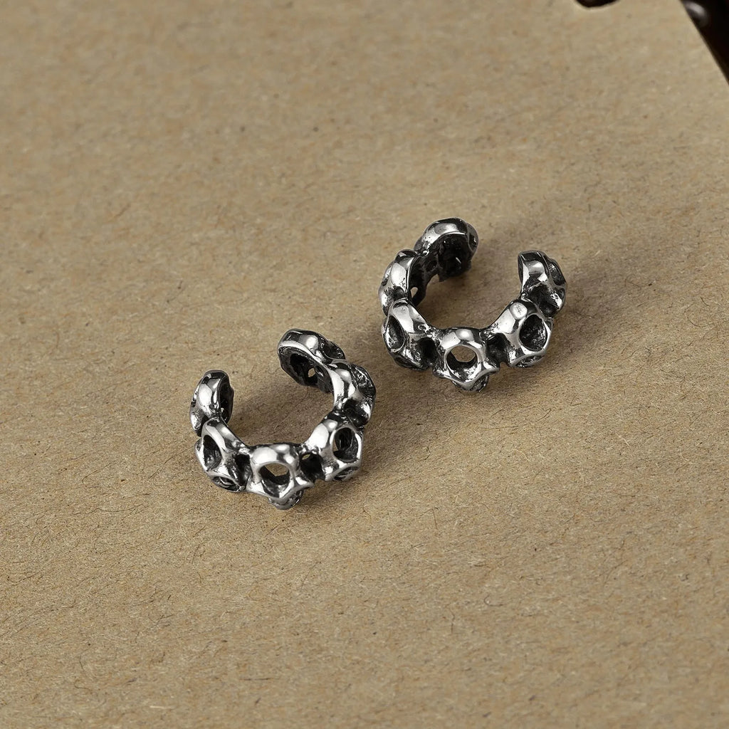 Retro hollow skull stainless steel clip earrings with geometry design