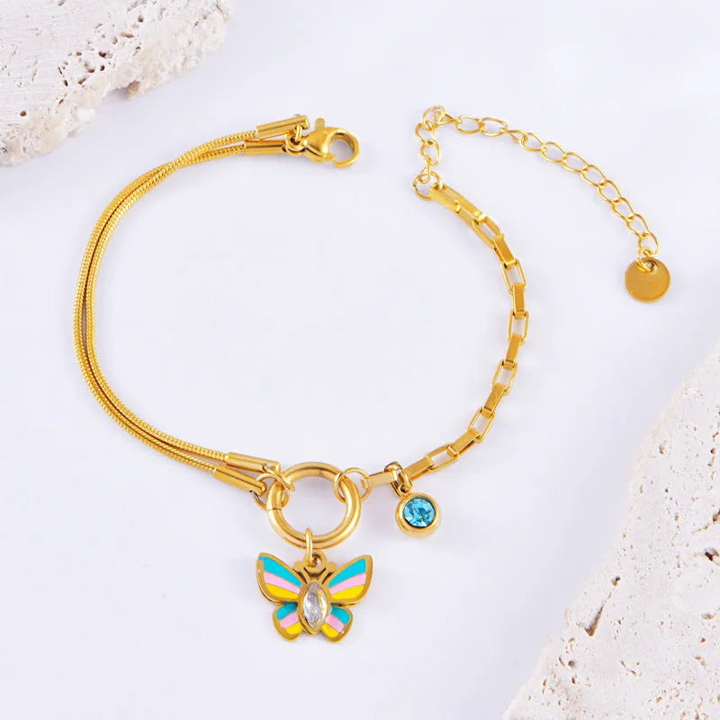 Gold tone epoxy butterfly necklace and bracelet set with snake bone chain.