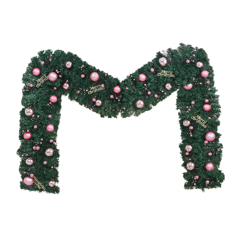 Pink artificial rattan Christmas garland with small fruit details and warm white LED lights, coiled to show its 2.7m length.