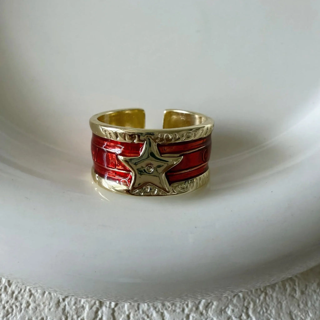 Adjustable copper ring with XINGX drop oil geometric design and distressed retro finish.