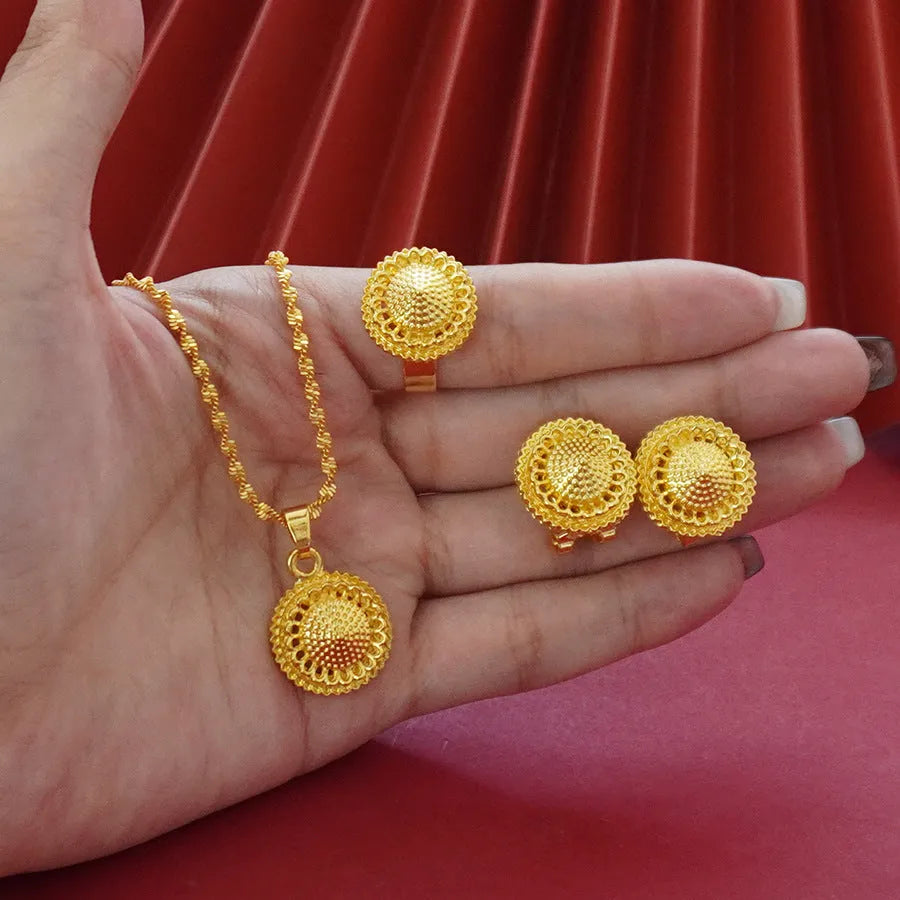 Three-piece gold-plated floral jewellery suit with necklace, earrings and ring on water wave chain