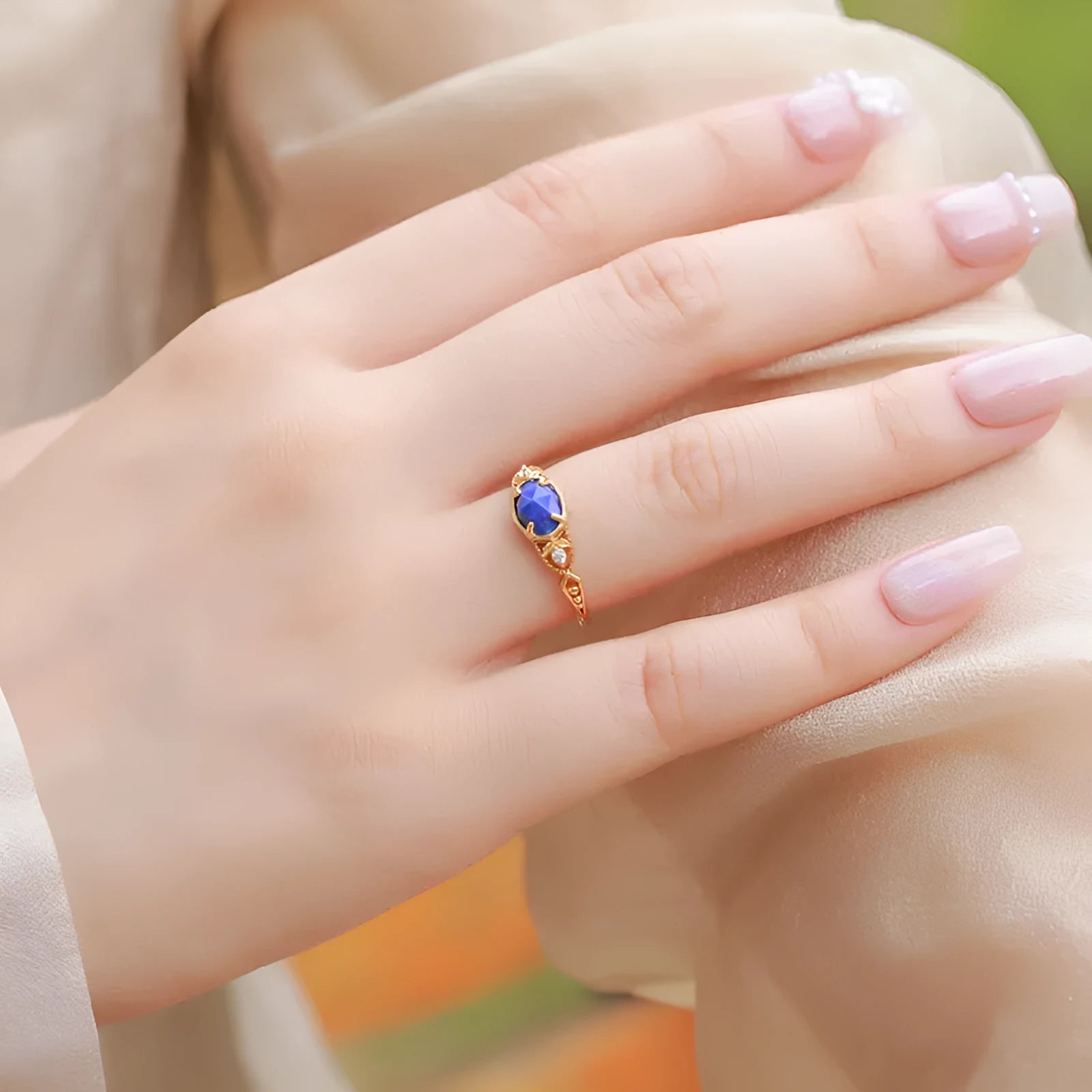 Geometric lapis lazuli silver ring with elliptical shape and round elements
