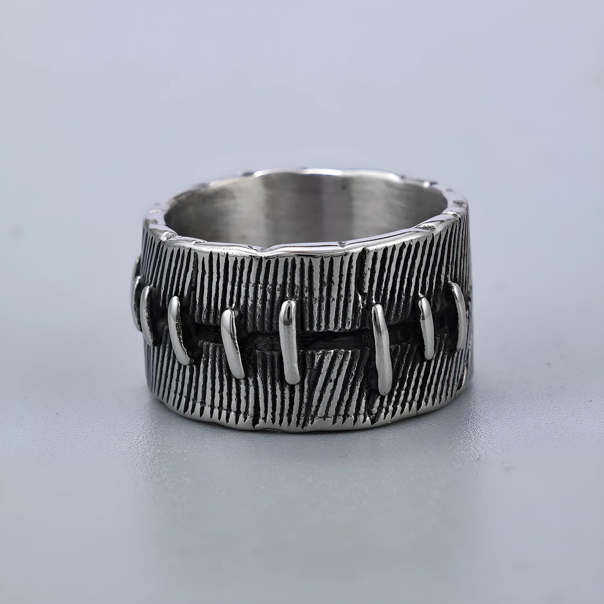 A geometric U-shaped titanium steel punk ring with a double ring design in a retro dark colour.