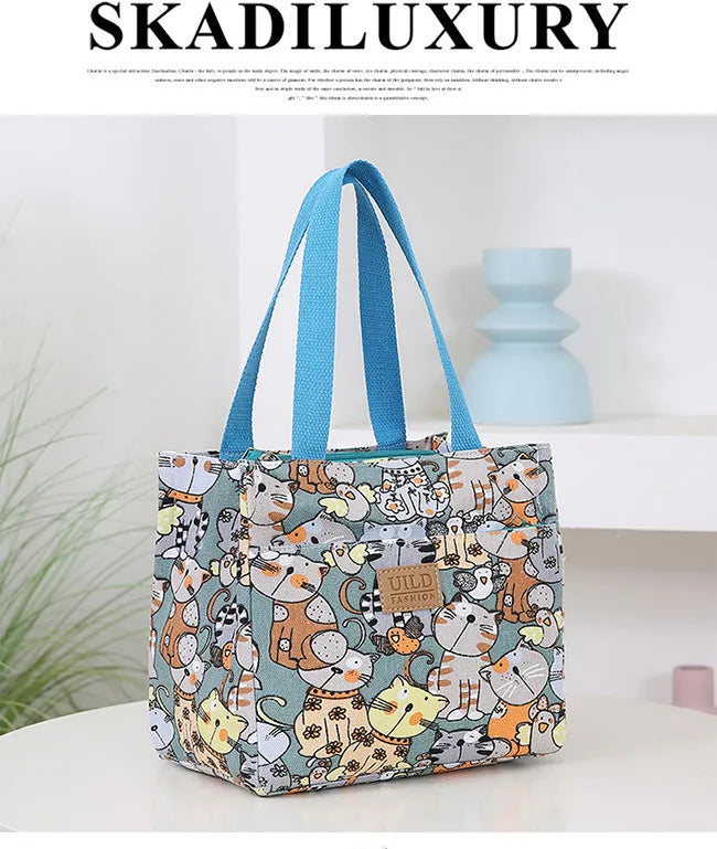 Women's printed canvas handbag with aluminium frame in square horizontal design showing floral pattern