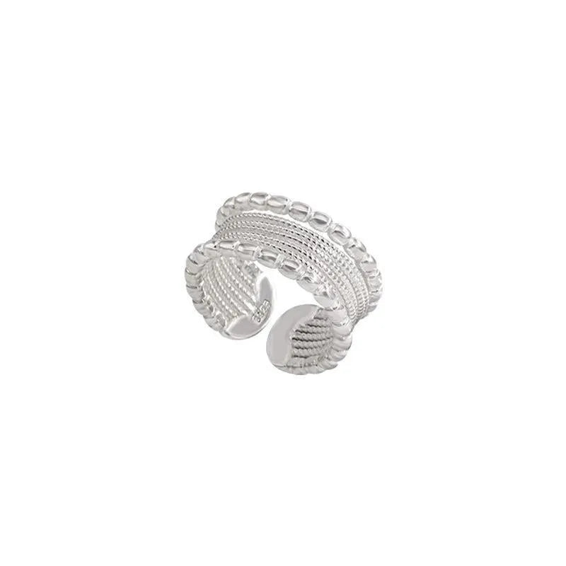 Geometric women's copper alloy ring with woven twisted design and adjustable opening