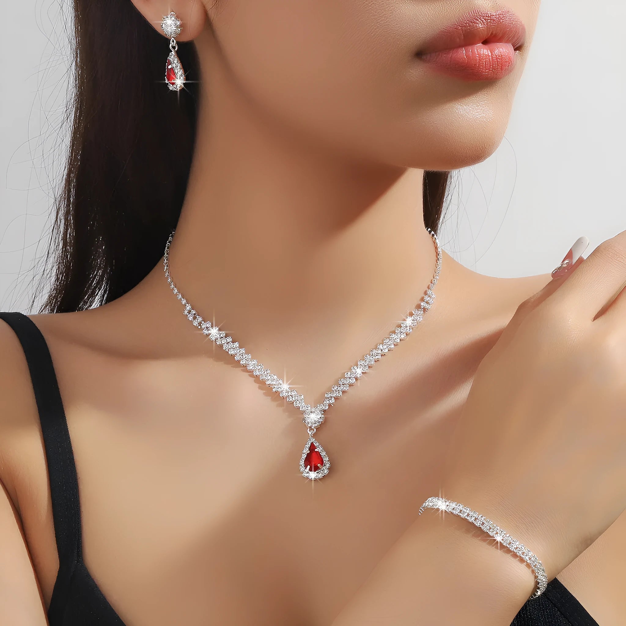 Women's claw chain necklace and earrings set with water drop rhinestones in multiple colour options