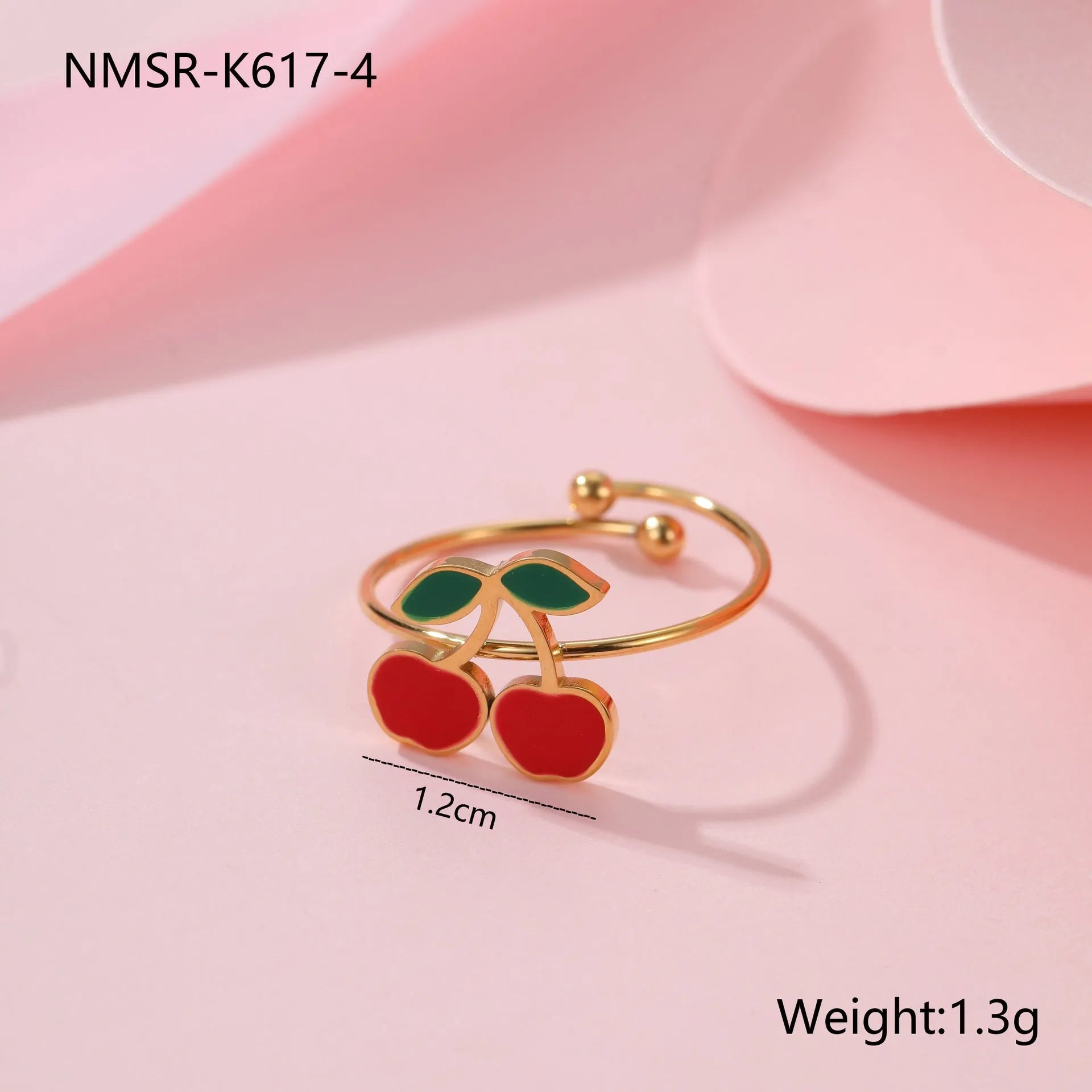 Cherry jewellery set showing necklace, bracelet, earrings, and ring with stainless steel construction and cherry fruit design