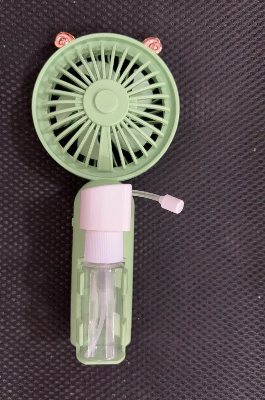 USB-powered personal handheld fan in apricot colour with plastic nozzle