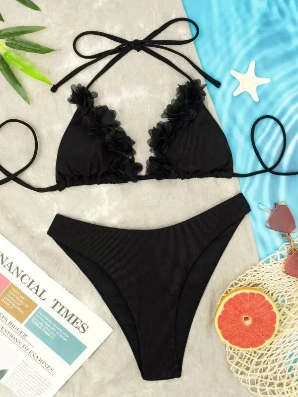 Black gathered swimwear set with matching top and shorts in European sizing