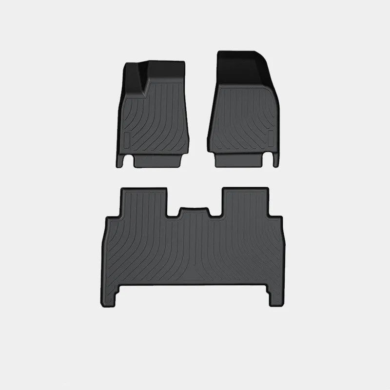 Tesla Model X black TPE rubber floor mats and boot liner set on car interior.