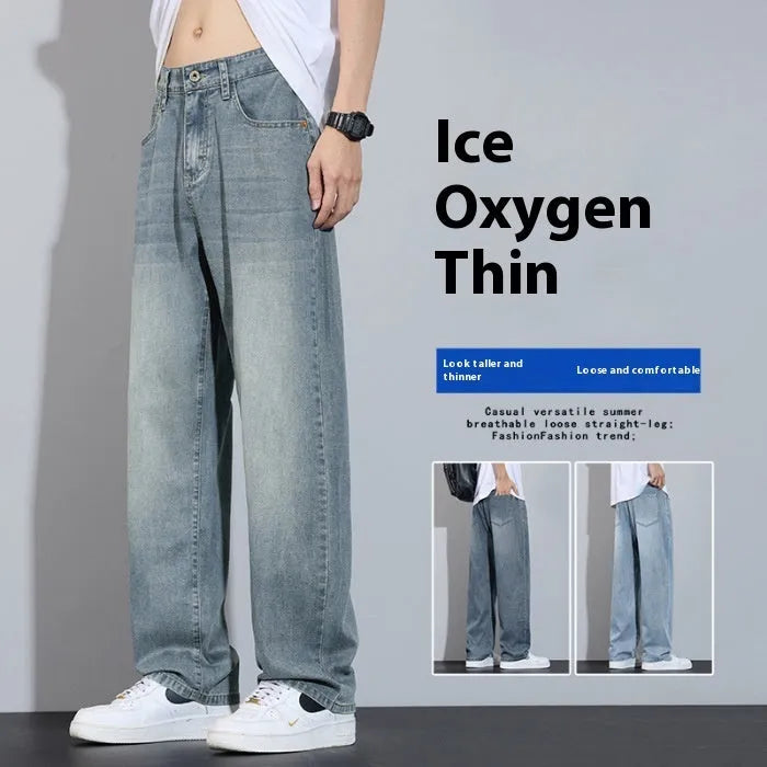 Light blue ice silk straight-leg wide trousers laid flat, showing zip fly and relaxed leg cut.