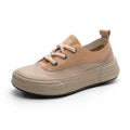 Women's matcha green leather platform sneakers with round toe and lace-up front.