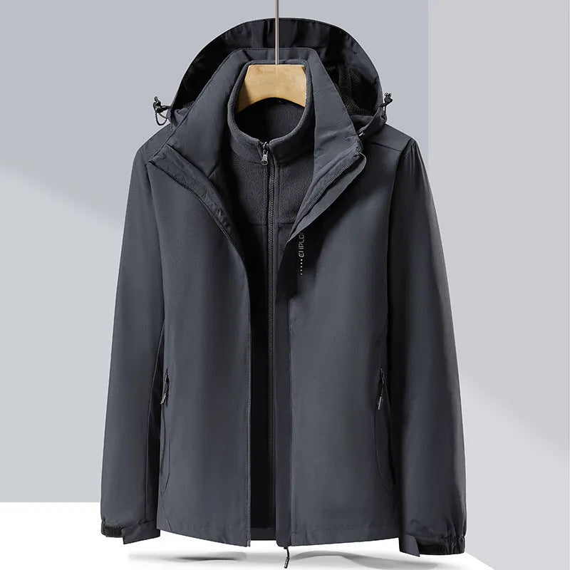 Men's black waterproof mountaineering jacket and trousers set with removable fleece lining.