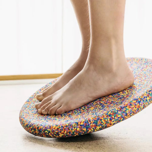 Children's plastic surf-shaped balance board in mixed wood colour and solid black option.
