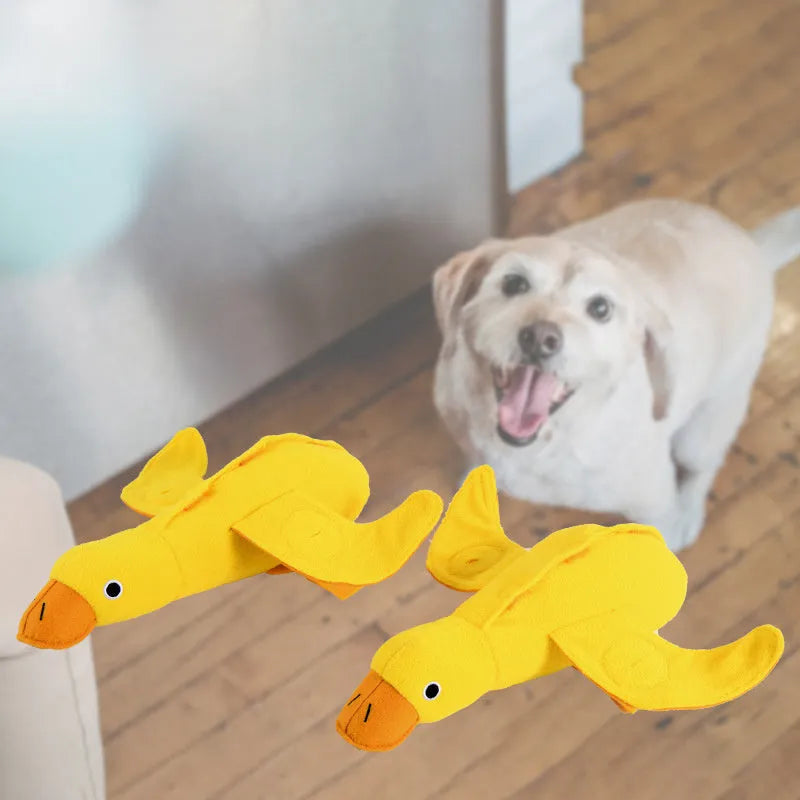 Yellow teddy dog toy with an attached duck doll, showing integrated food leak pockets for treats.