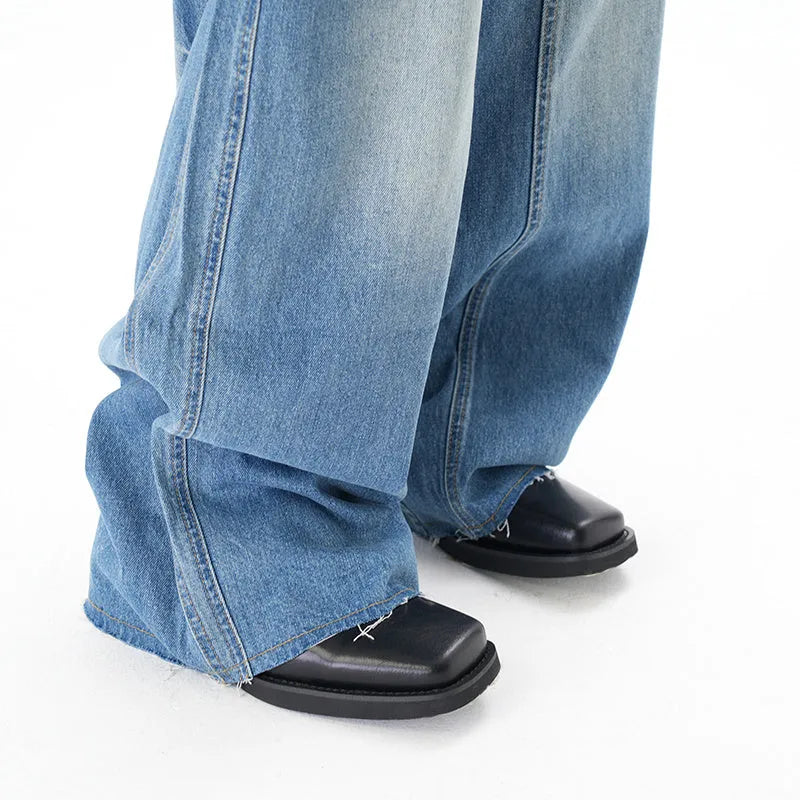 Light blue vintage washed wide leg jeans with zipper closure on mannequin
