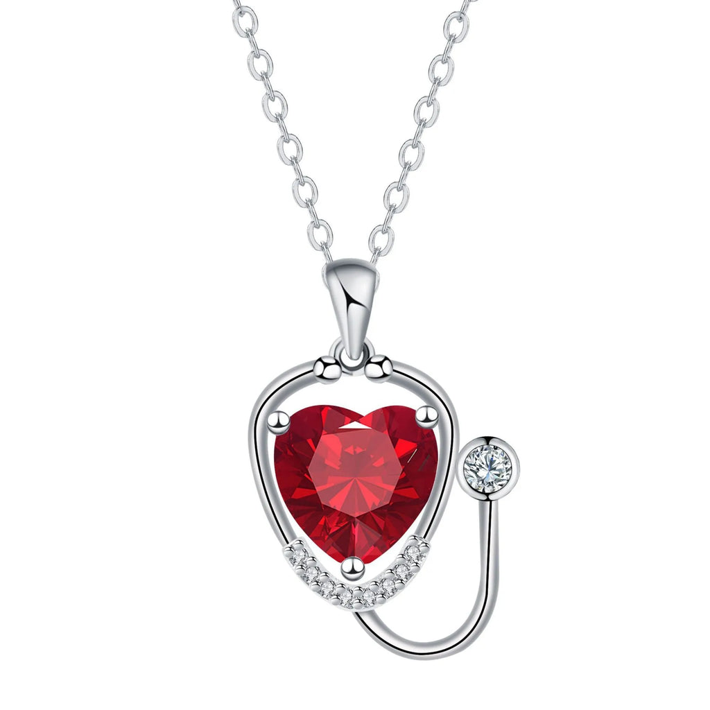 Women's copper necklace with stethoscope charm featuring wings and cross design in red diamond colour