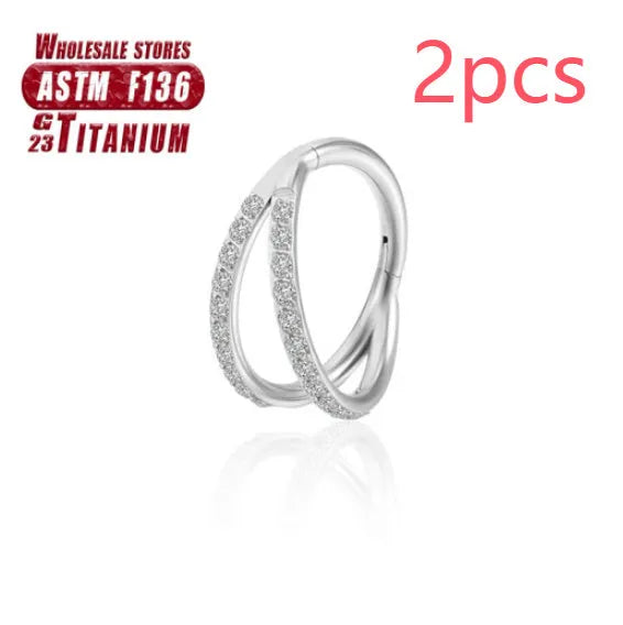 Titanium alloy fork nose ring in silver colour on a plain background, showing its shape and size.