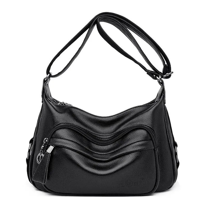 Blue women's large crossbody shoulder bag with multiple internal compartments and soft horizontal square design
