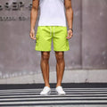 Men's loose fit work shorts in fluorescent green or army green colours with straight leg design