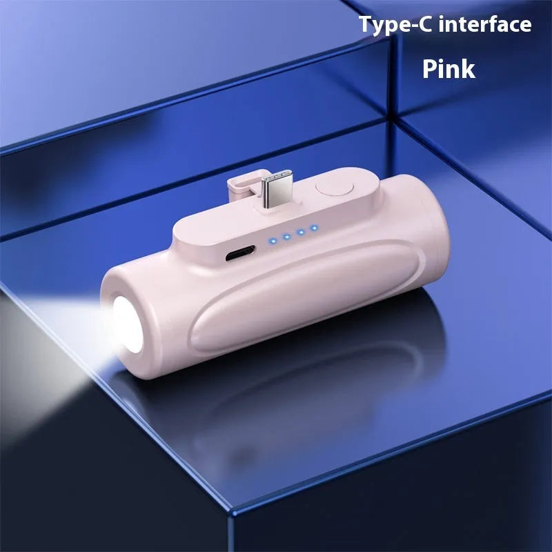 Black creative power bank with LED flashlight showing Type-C charging port and compact 83mm size