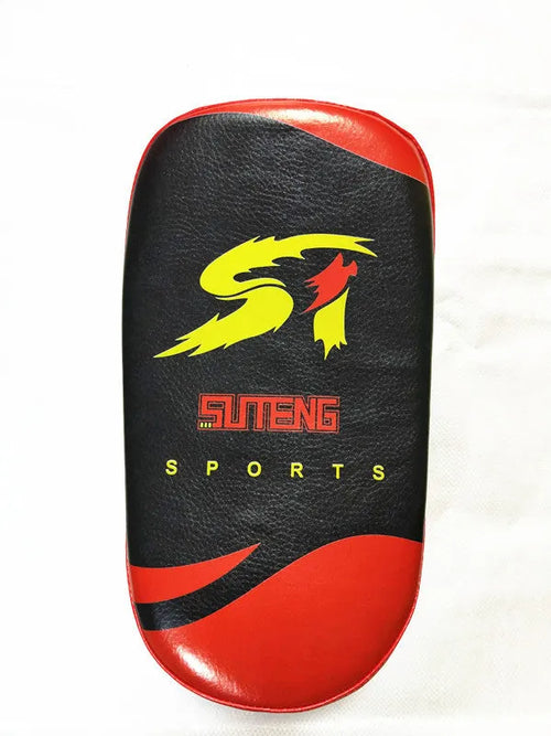 Black and red square hand-held martial arts kick pad with a double buckle strap on the back.