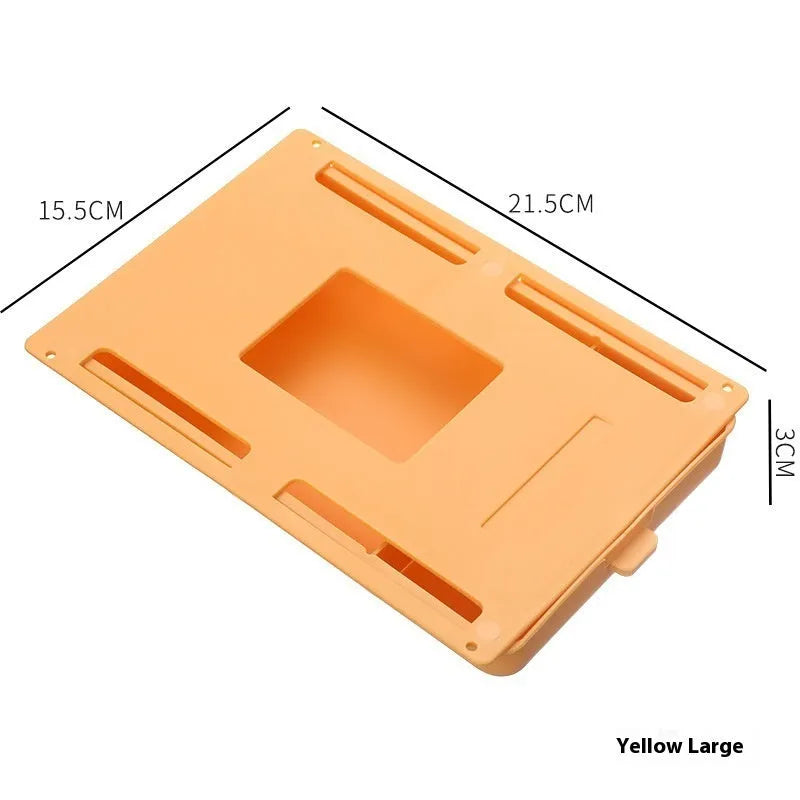 Adhesive under table storage drawer in plastic with covered grid design, shown in grey colour