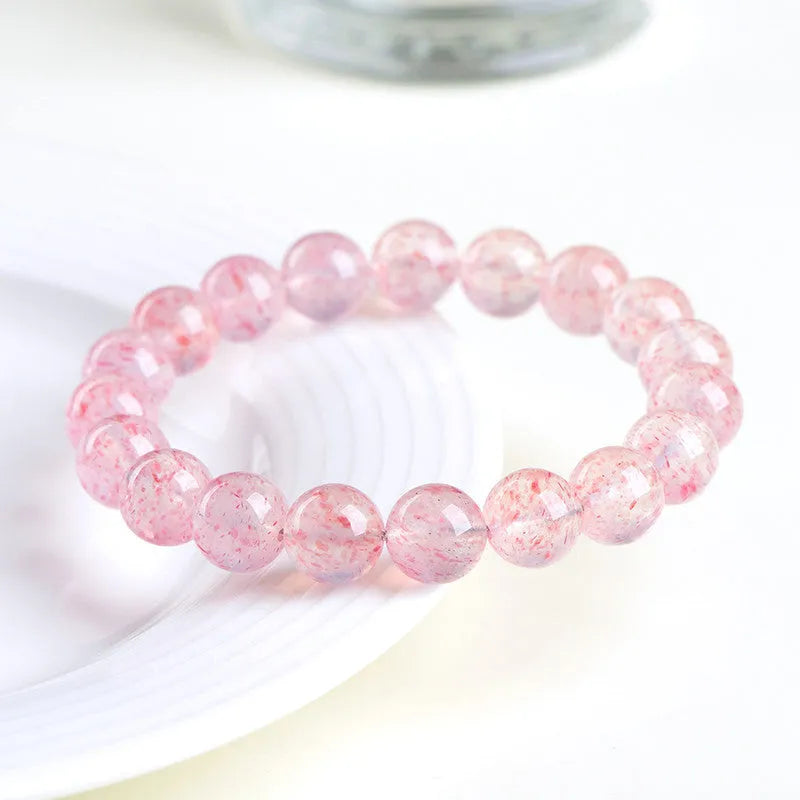Natural white strawberry quartz crystal bracelet with 10-10.8mm polished beads on elastic cord