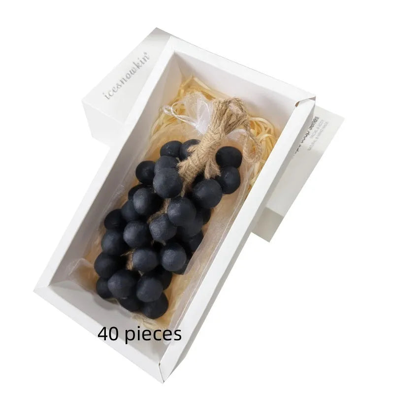 Handmade grape soap bars in black, green, and purple grape scents alongside litchi soap, with gift box and mesh bag packaging