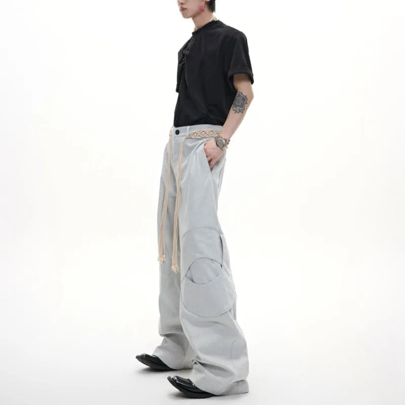 Men's straight-leg cotton trousers in dark colours with placket zipper and decorative pocket details