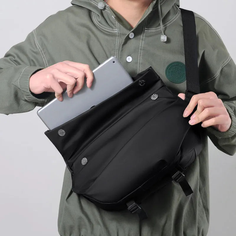 Men's grey crossbody bag showing internal phone pocket and document compartment with shoulder strap