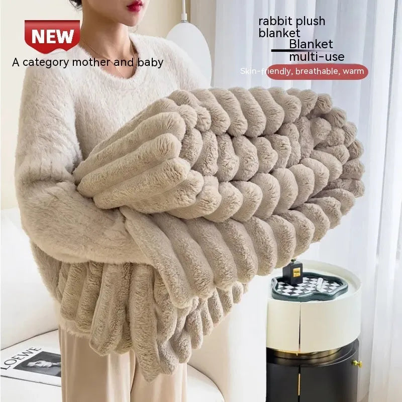 Soft Wind double-sided thickening bubble velvet blanket in a solid colour shown on a sofa.