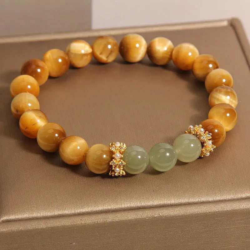 Natural yellow Tiger's Eye Hetian Jade bracelet in U-shape with gold gourd charm.