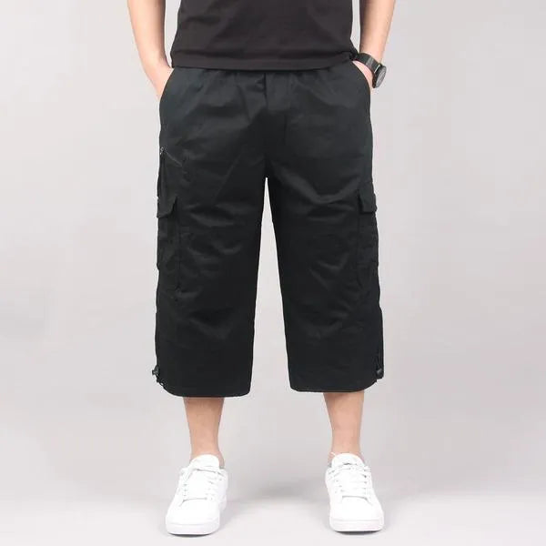 Man wearing loose khaki cotton cropped casual pants for sports.