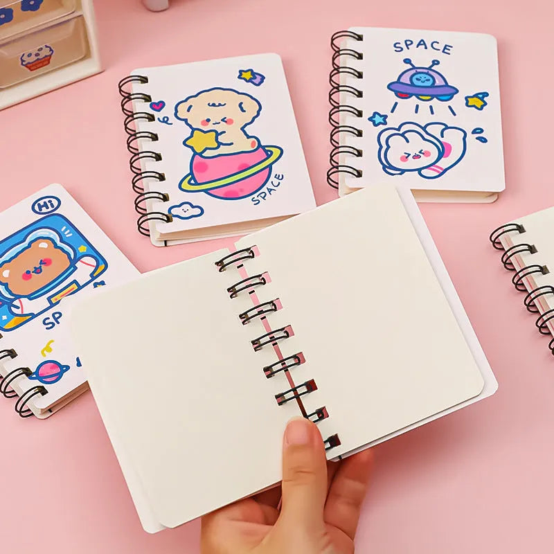 Astronaut-themed pocket notebook with flip closure showing 10.5 × 8 cm dimensions