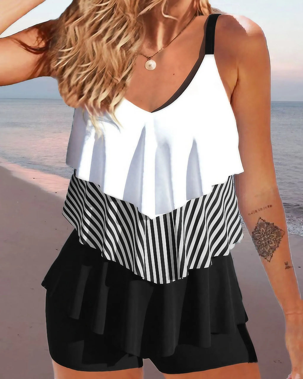Women's sleeveless spaghetti-strap bikini with ruffle trim and split-side briefs in a floral print.