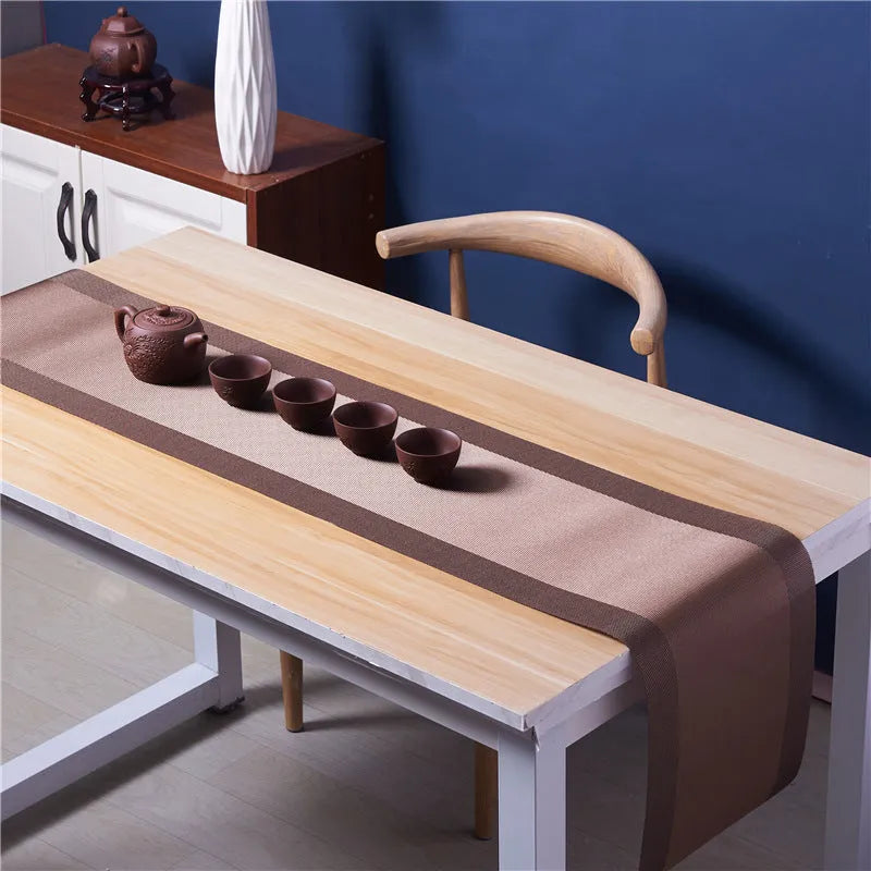 Modern PVC non-slip placemat in gradient bamboo colour on a table.