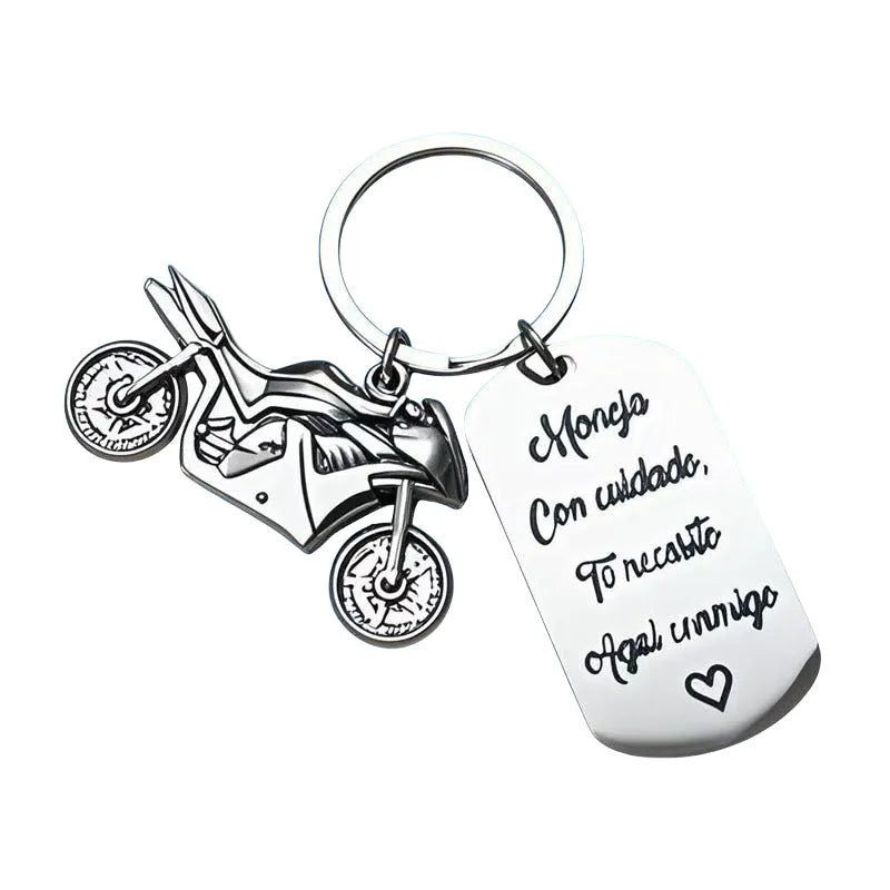 Stainless steel motorcycle keychain with velvet gift pouch in modern minimalist design