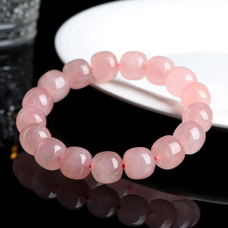 Pink crystal barrel bead bracelet with geometry design and polished finish