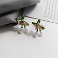 Women's alloy flower earrings with sterling silver needle design and clip-on alternative