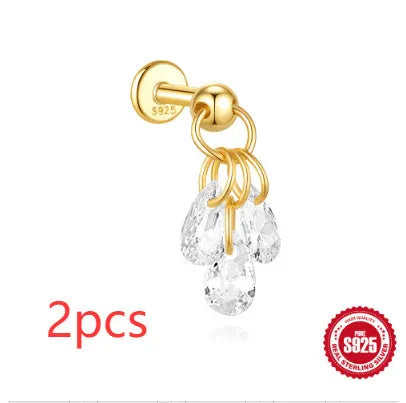 S925 sterling silver geometric star earrings with embedded moon and diamond detail in a gold colour.