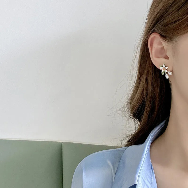 Women's alloy flower earrings with sterling silver needle design and clip-on alternative