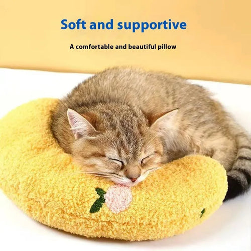 Blue moon-shaped and yellow question mark-shaped cloth pillows for cats, showing U-shaped neck support design.