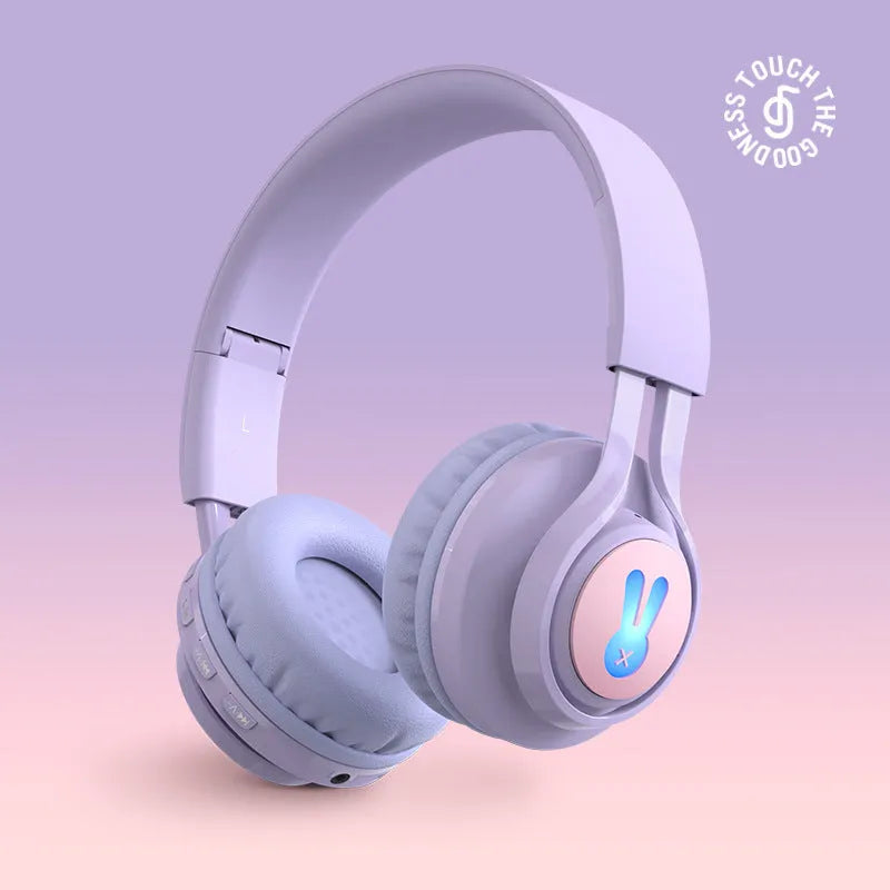 Wireless RGB LED headphones for children in bunny pink with lights illuminated