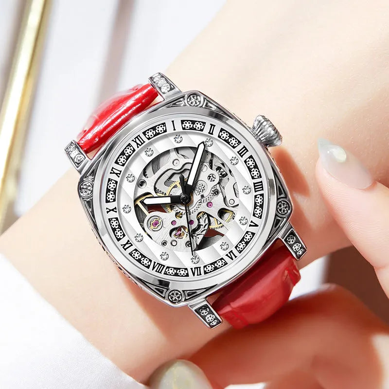 Mechanical watch with luminous hands and leather strap in choice of colours.