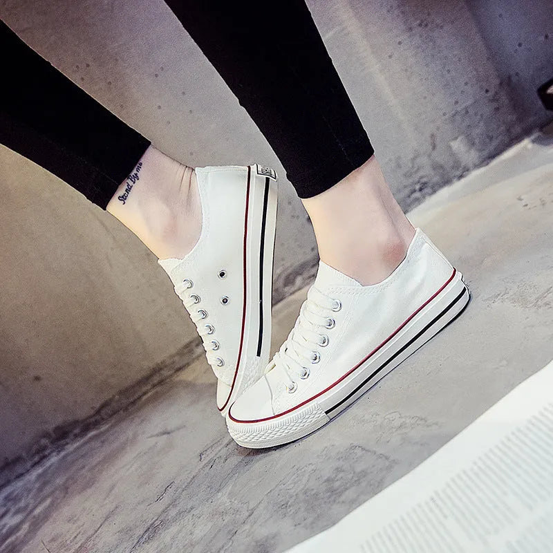 Women's solid colour casual canvas shoe on a white background.
