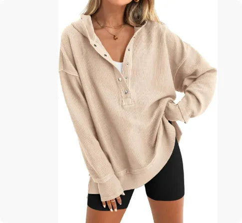 Women's loose fit peacock green raglan sleeve pullover sweater on a hanger.