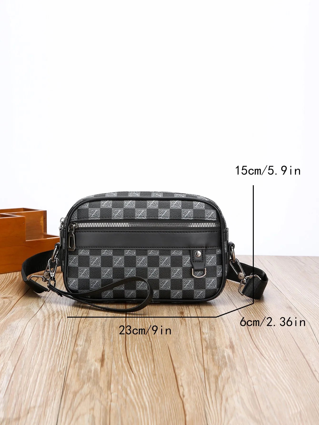 Men's geometric pattern PU messenger bag shown in a horizontal carry position.