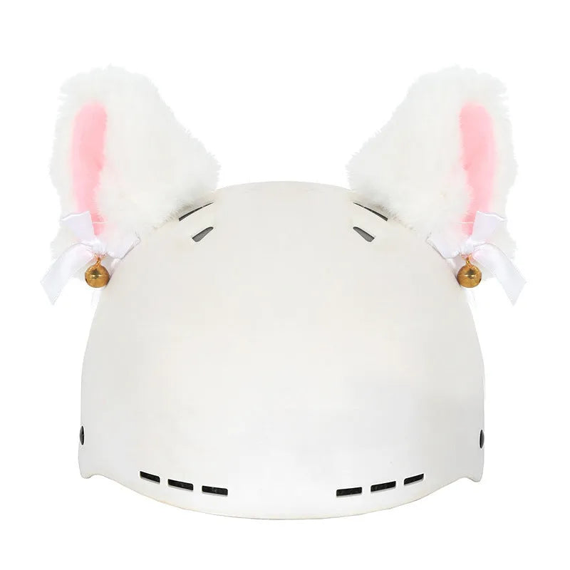 Plush fabric ski helmet decoration with cartoon design on a black ski helmet.