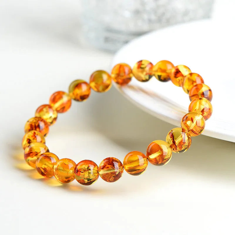Natural yellow piebald amber geometric bracelet with polished beads